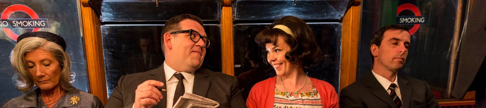 Olivia Colman and Nick Frost sat on a train