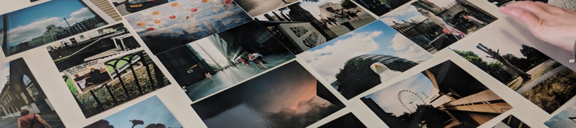 A collage of photographs laid out on a table