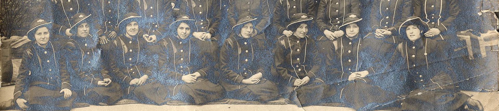 B/W print; Group shot of LGOC women conductors taken at Hackney bus garage, circa 1916
