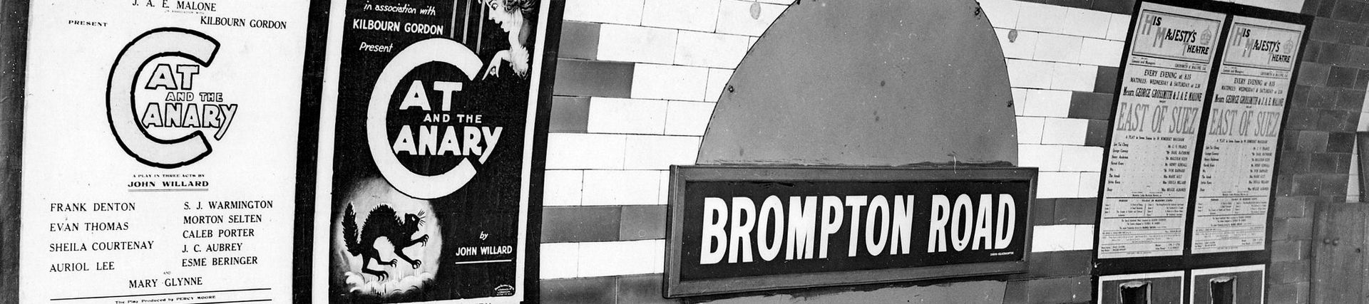 Platform view at Brompton Road station showing station roundel nameplate and advertising by Topical Press, 1923